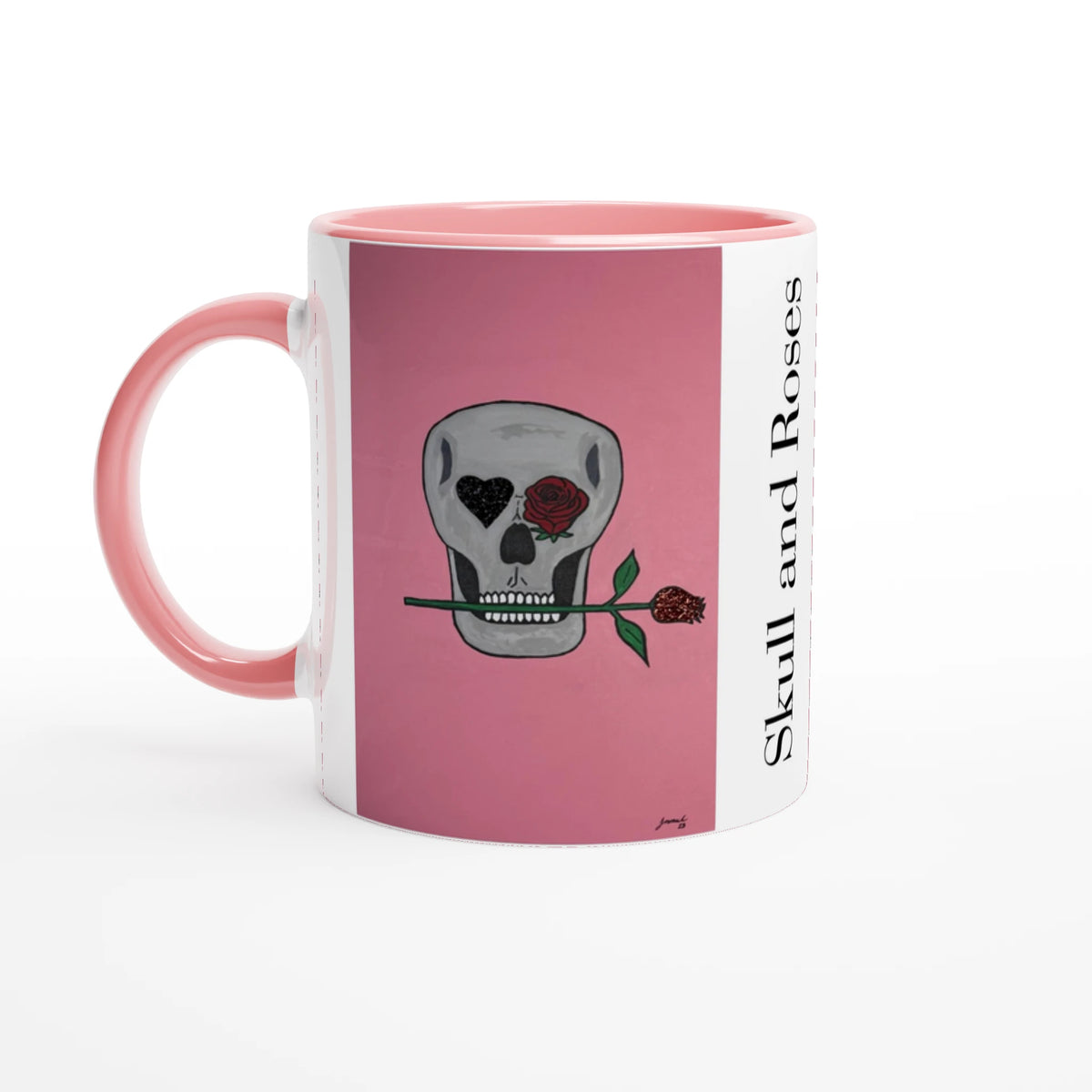 11 oz glossy ceramic mug showing Johnny X's Skull and Roses: gray skull on pink background with roses and a glittering heart eye