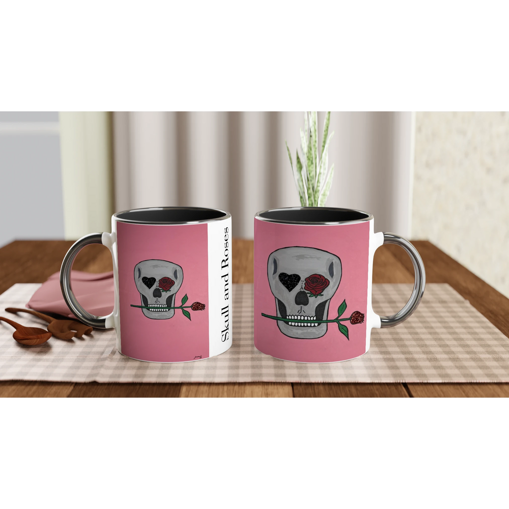 11 oz glossy ceramic mug showing Johnny X's Skull and Roses: gray skull on pink background with roses and a glittering heart eye