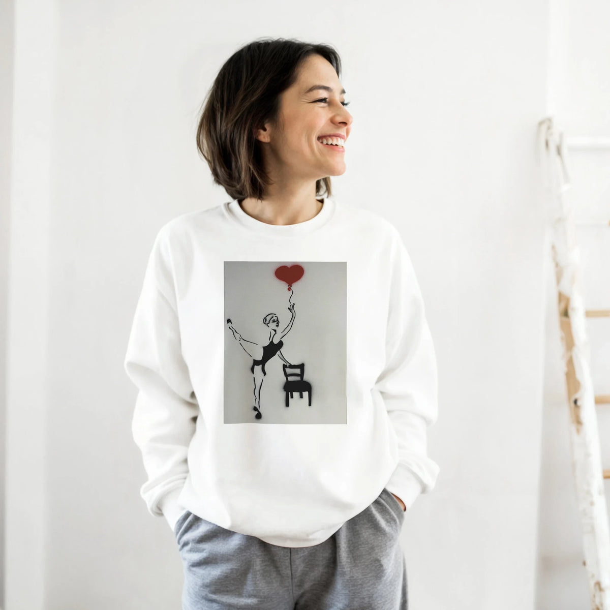 Classic heavy-blend crewneck featuring Johnny X’s Balloon of Love: a ballerina beside an empty chair with a single red heart balloon