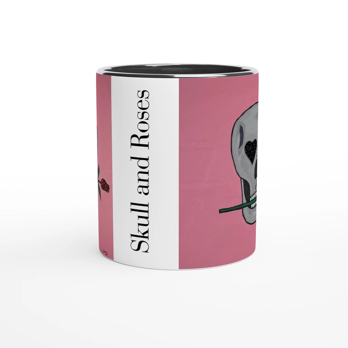 11 oz glossy ceramic mug showing Johnny X's Skull and Roses: gray skull on pink background with roses and a glittering heart eye