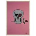 Framed 24×36 Johnny X canvas showing a gray skull on pink field, one eye a black heart, the other a red rose, a rose between its teeth.