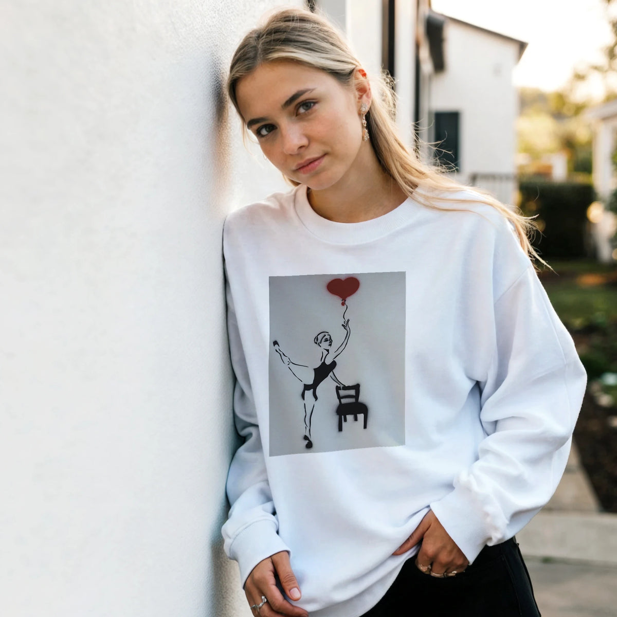 Classic heavy-blend crewneck featuring Johnny X’s Balloon of Love: a ballerina beside an empty chair with a single red heart balloon