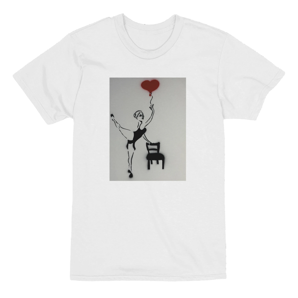 Heavyweight unisex tee printed with Johnny X’s Balloon of Love: a ballerina by an empty chair and a red heart balloon