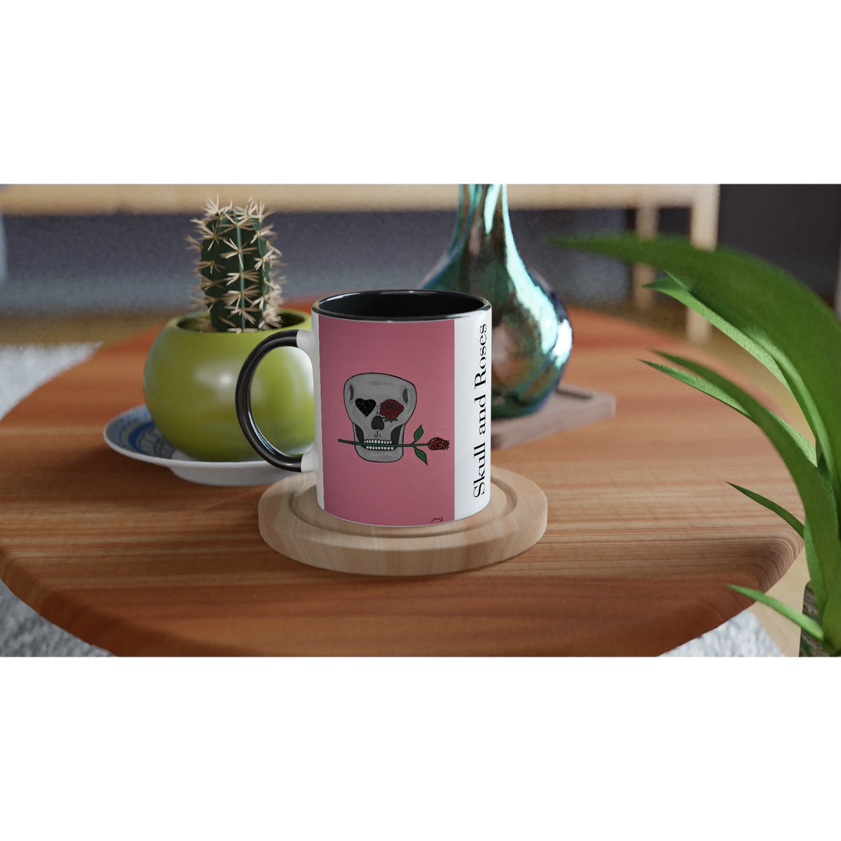 11 oz glossy ceramic mug showing Johnny X's Skull and Roses: gray skull on pink background with roses and a glittering heart eye