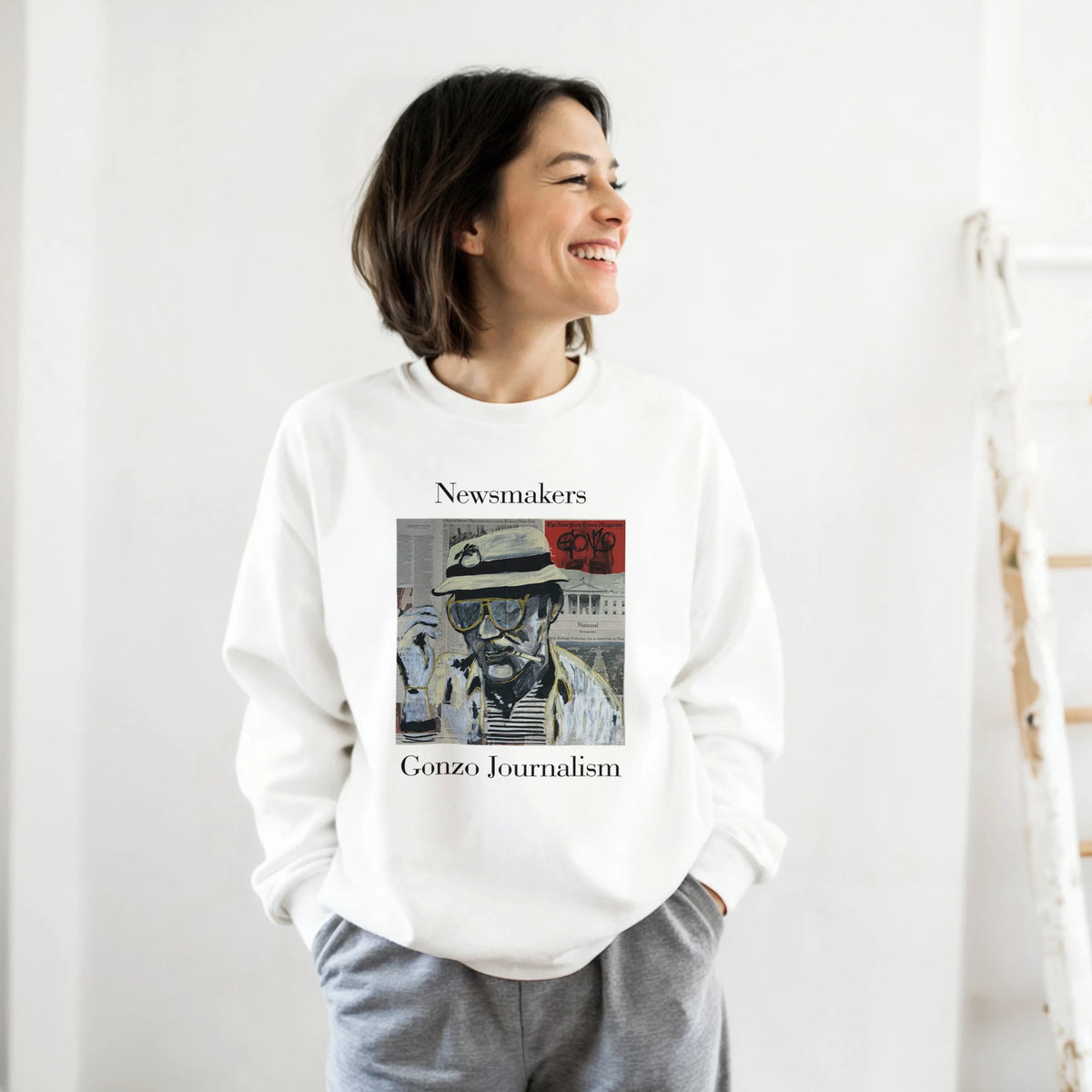 Classic heavy-blend crewneck sweatshirt printed with Johnny X’s Newsmakers — Gonzo Journalism portrait over newspaper pages in black, white and gold.